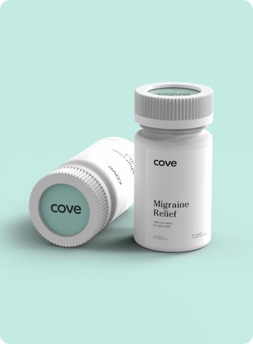 Woman's hands opening a bottle of migraine medication.